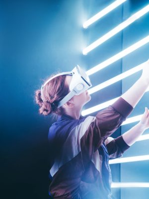 girl-using-vr-goggles-in-colorful-neon-lights.jpg